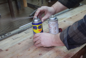 how to clear the opening on a spray can